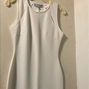 Almost Famous designer label, stretchy fitted with cut outs at upper chest area